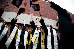 Honors grads throwing their caps in the air