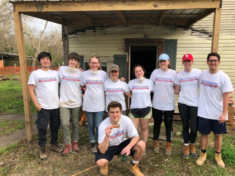 Honors students volunteering time to repair houses